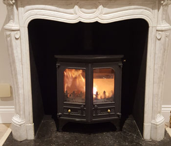 Charnwood Country 6 Wood Burner - installation into Louis IX marble fireplace with polished granite hearths in Claygate, near Esher, Surrey.